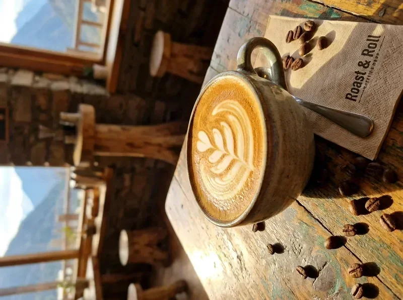 Handcrafted espresso latte art at Roast and Roll coffee shop